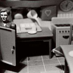 Woman Behind Refrigerator Door